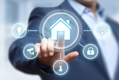Man in suit touch a hologram home icon