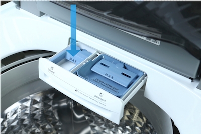 Demonstration of the compartments in a top load washer detergent drawer