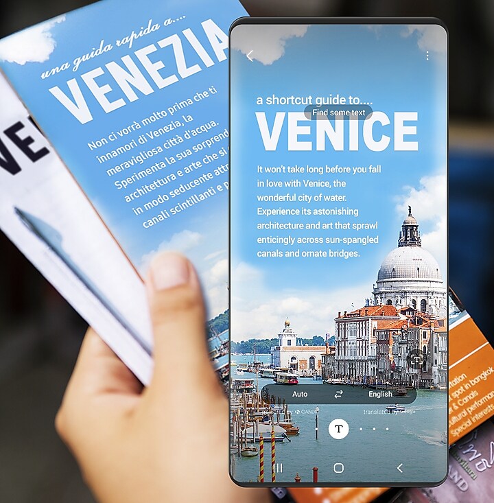 The left hand holding a Venice Public Relations Brochure, written in Italian. It overlapped with Bixby Vision showing the English translation of the brochure. The left hand holding a Venice Public Relations Brochure, written in Italian. It overlapped with Bixby Vision showing the English translation of the brochure.