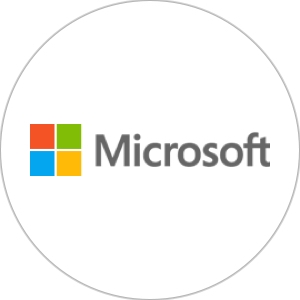 The Microsoft logo of four little multi-colored squares that make a big square and the word "Microsoft" against a white background