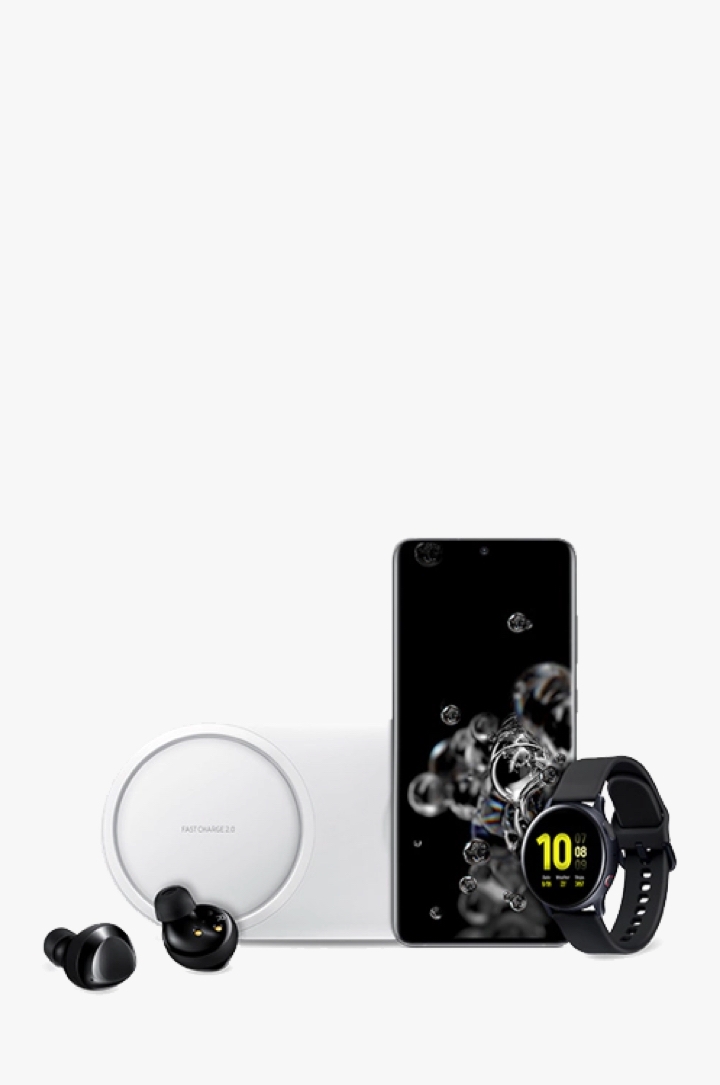 A collection of a black pair of Galaxy Buds+, a Galaxy S20 Ultra and a black Galaxy Watch Active2, shown side-by-side in front of a white wireless charging pad
