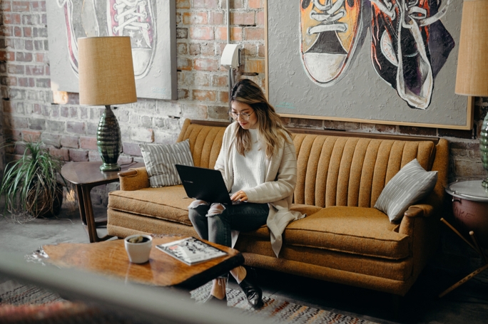 Woman connecting with her team via a video call to remotely work from home