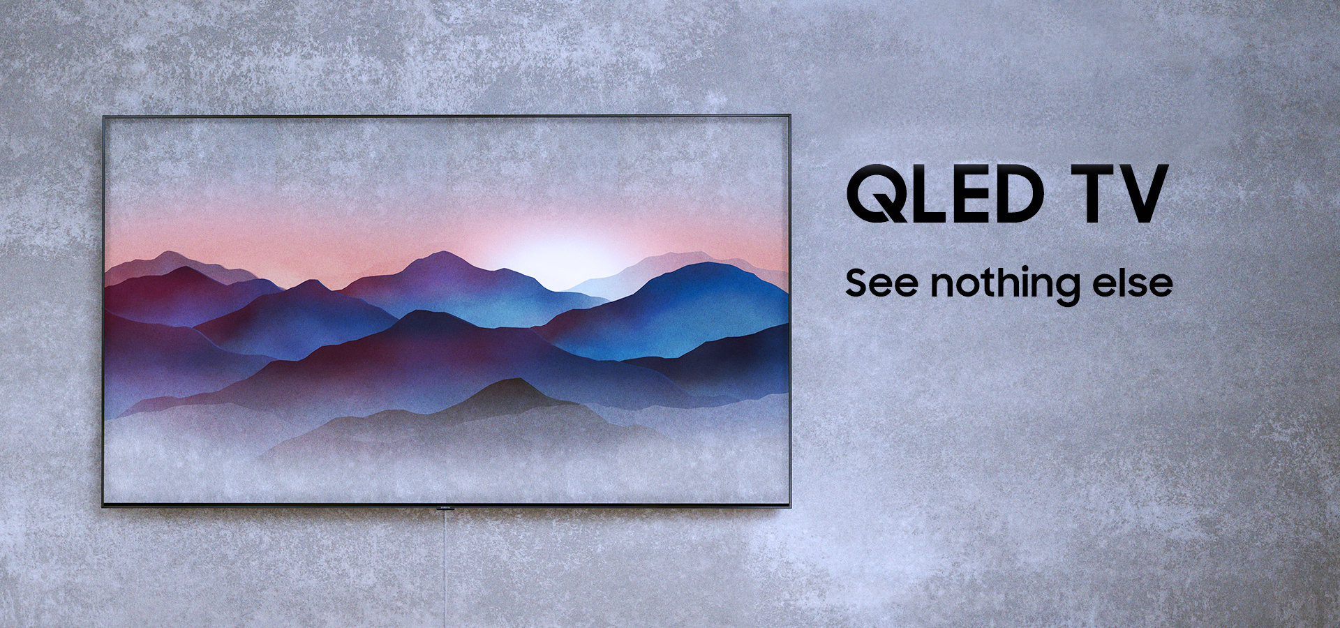 Three angles of Samsung’s new QLED TVs are put on the floor in dark room. Left far one is facing back, middle one ins facing right front with Ambient Mode onscreen on and the right closest one is facing back.