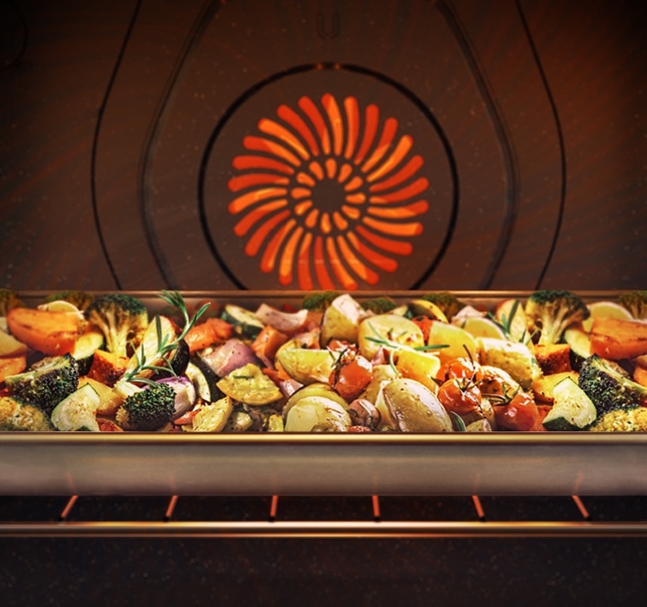 Nutritious and delicious vegetables Tray of Roasting Vegetables Inside an Active Convection Oven