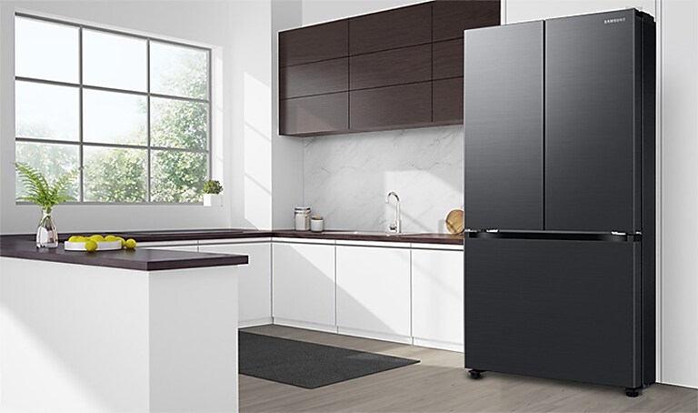 Black 3 door refrigerator in kitchen flush with cabinets Black 3 door refrigerator in kitchen flush with cabinets