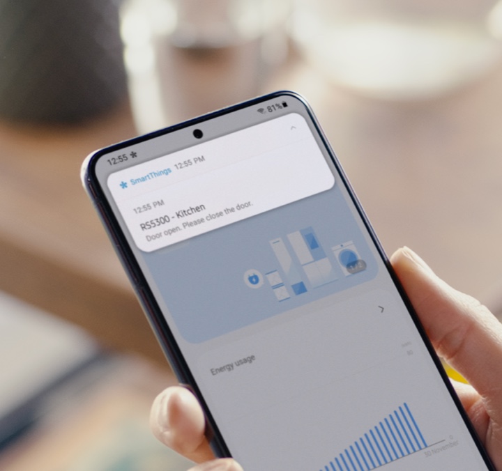 Get useful notifications Person using smart phone to use SmartThings app