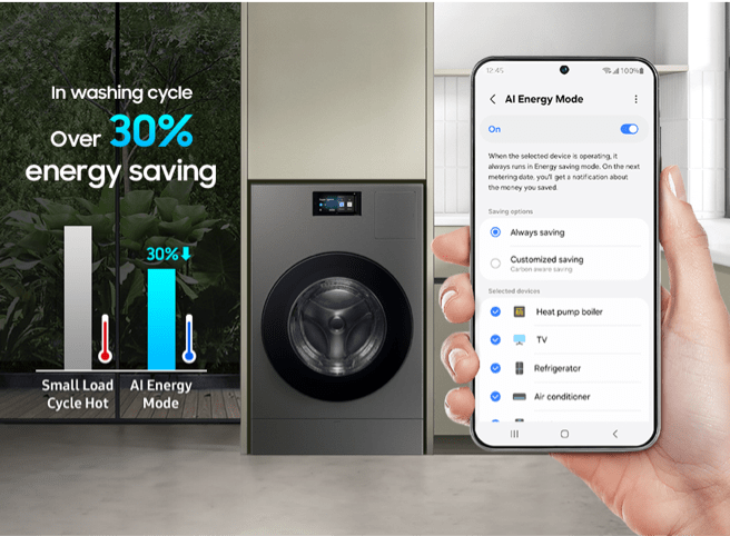 Smart energy savings Person with smartphone connected to washer dryer via SmartThings and showing energy efficiency