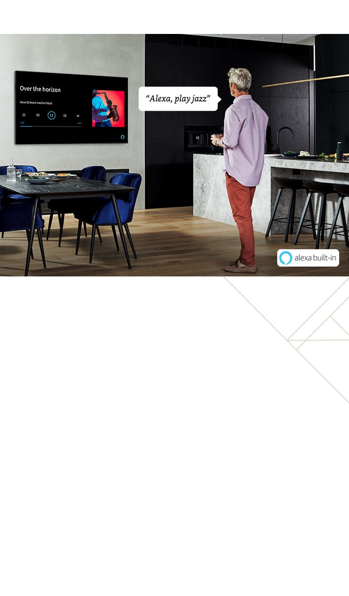 Samsung QLED TV has a voice assistant named Bixby. Speak directly to QLED, Bixby recognizes the conversation. TV onscreen is showing "Recommend TV shows for me "