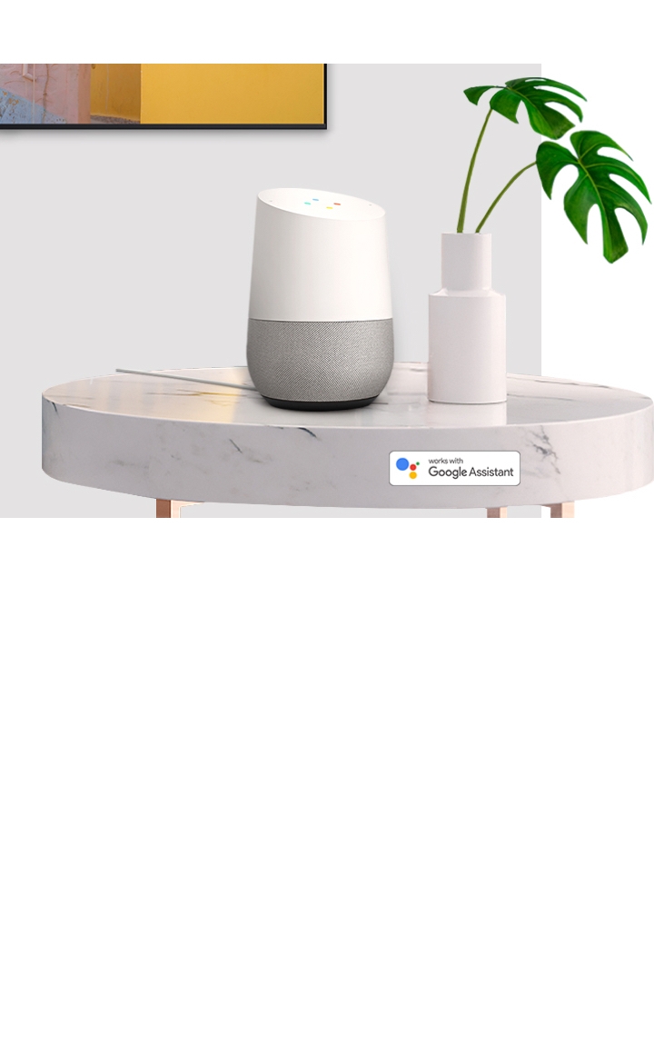 Samsung QLED TV has a voice assistant named Bixby. Speak directly to QLED, Bixby recognizes the conversation. TV onscreen is showing "Recommend TV shows for me "