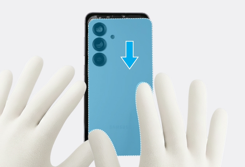 Gloved hands pressing down on the edges of the back cover of the Galaxy S25.