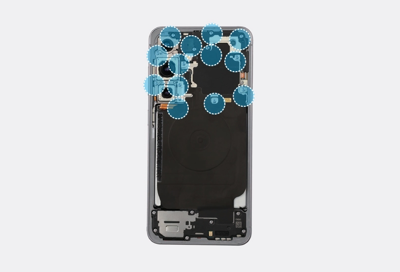 Screws highlighted around the top section of the Galaxy S25 interior.