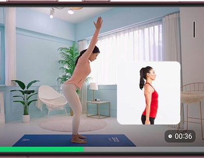 Small window of user on the lower right of workout video