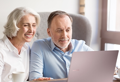 Older couple using Galaxy book S Older couple using Galaxy book S