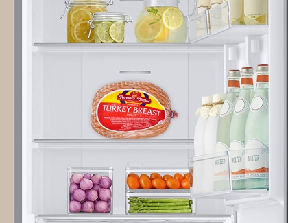 Frozen turkey being defrosted in the Refrigerator