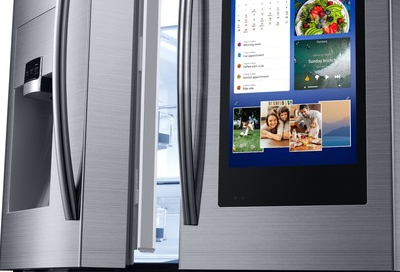Samsung Family Hub refrigerator with door slightly ajar Samsung Family Hub refrigerator with door slightly ajar