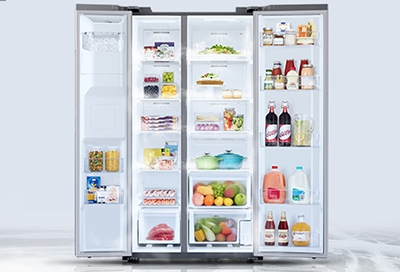 An open Samsung refrigerator filled with food