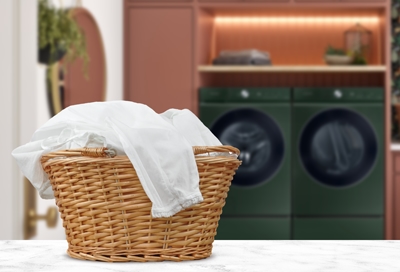 White clothes in a laundry basket with Samsung washing machine in the background