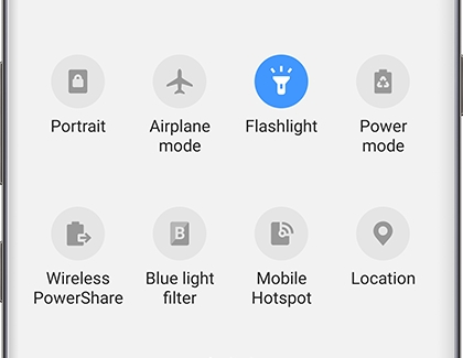 The Flashlight turned on in the Quick Settings panel The Flashlight turned on in the Quick Settings panel