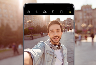 Man standing outside taking a selfie Man standing outside taking a selfie