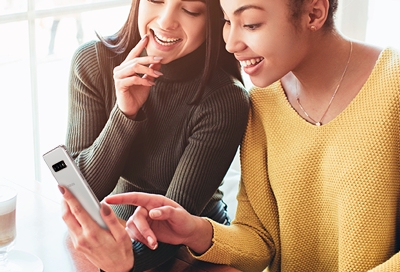 Two women looking at a phone Two women looking at a phone