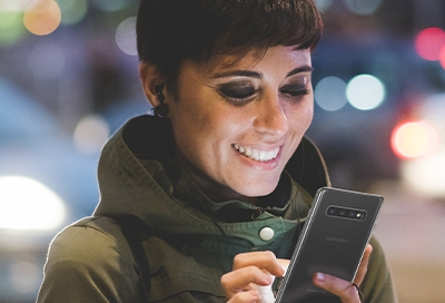 Woman looking at phone at night Woman looking at phone at night