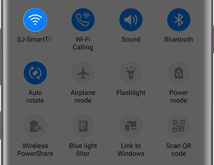 Quick Settings panel with the Wifi icon highlighted Quick Settings panel with the Wifi icon highlighted