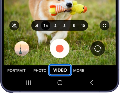 A purple Galaxy S26 phone showing the camera app with the VIDEO option highlighted in blue at the bottom.