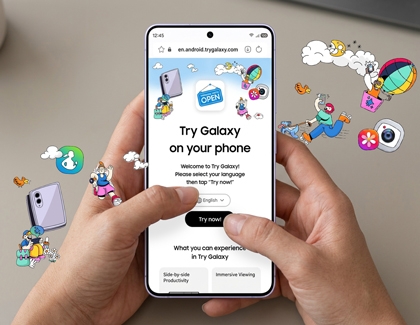 Hands holding a smartphone displaying the Try Galaxy website with playful illustrations floating around it.