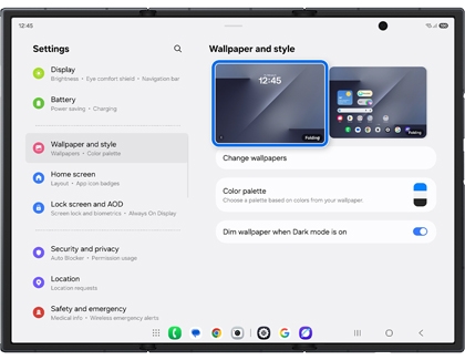 A Galaxy Z TriFold showing the Wallpaper and style menu with the lock screen preview highlighted by a blue rounded box.