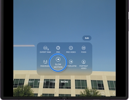 A Galaxy phone showing the camera app with the More tab open and the Slow Motion option selected.