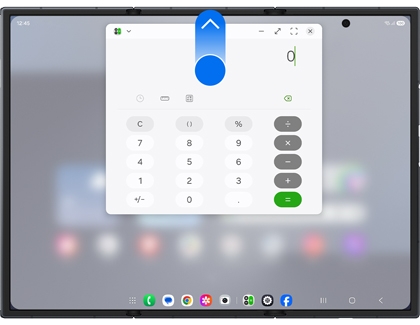 Calculator app window on the Galaxy Z TriFold with a blue arrow pointing up from a blue circle at the top center.