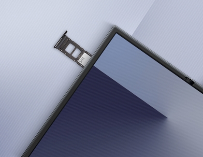 A close-up of the Galaxy Z TriFold showing the SIM card tray partially ejected from the top edge of the device.