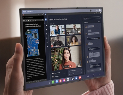 Hands holding the unfolded Galaxy Z TriFold displaying a video call window next to a document window with a diagram of a circuit board.