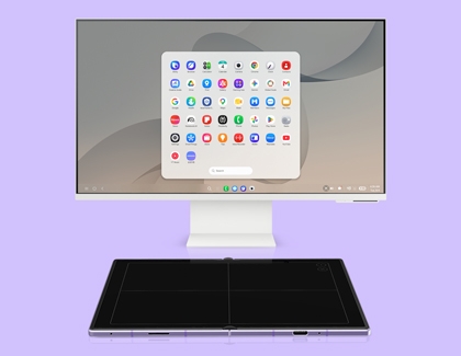 A monitor displaying Samsung DeX with an open app grid and an unfolded Galaxy Z Fold8 acting as a touchpad.