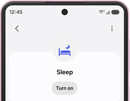 A Galaxy phone screen showing the Sleep mode menu with a bed icon and a Turn on button.