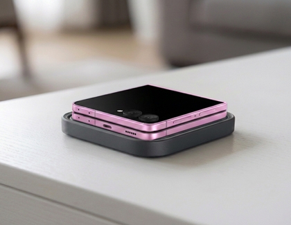 A pink Galaxy Z Flip8 displayed on a wireless charging pad.