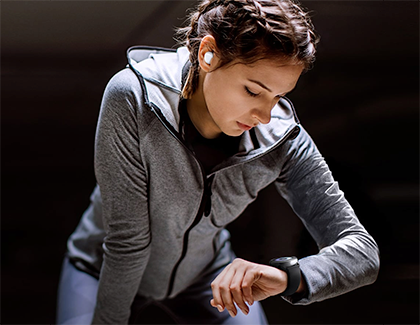 Woman looking at her Galaxy Watch Woman looking at her Galaxy Watch