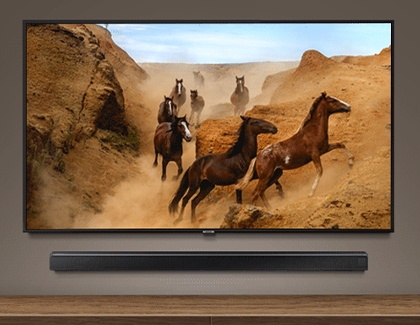 Horses in a desert scene on a Samsung TV with a soundbar