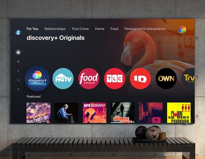 The discovery+ Home screen displayed on a TV