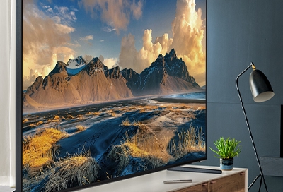 QLED TV displaying a picture of a canyon