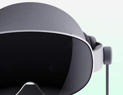 Galaxy XR headset connected with a cable on a light background.