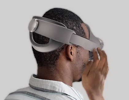 Person touching the side touchpad on a Galaxy XR headset.