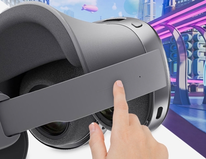 Hand pressing the side button on a Galaxy XR headset to switch between modes.