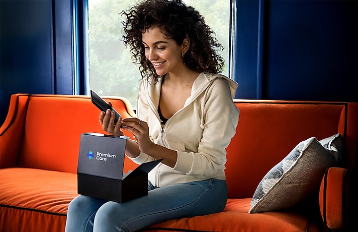 Woman opening Samsung Premium Care package Woman opening Samsung Premium Care package
