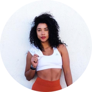 A face-on shot of Hannah Bronfman in workout gear looking at the camera