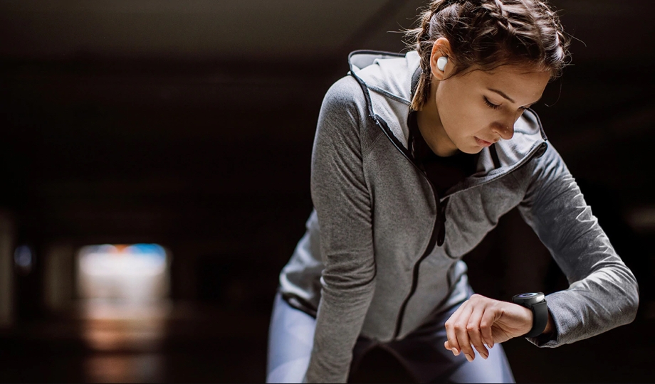 Photo of woman exercising with Galaxy Watch Active