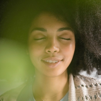 Woman meditating and practicing mindfulness exercises