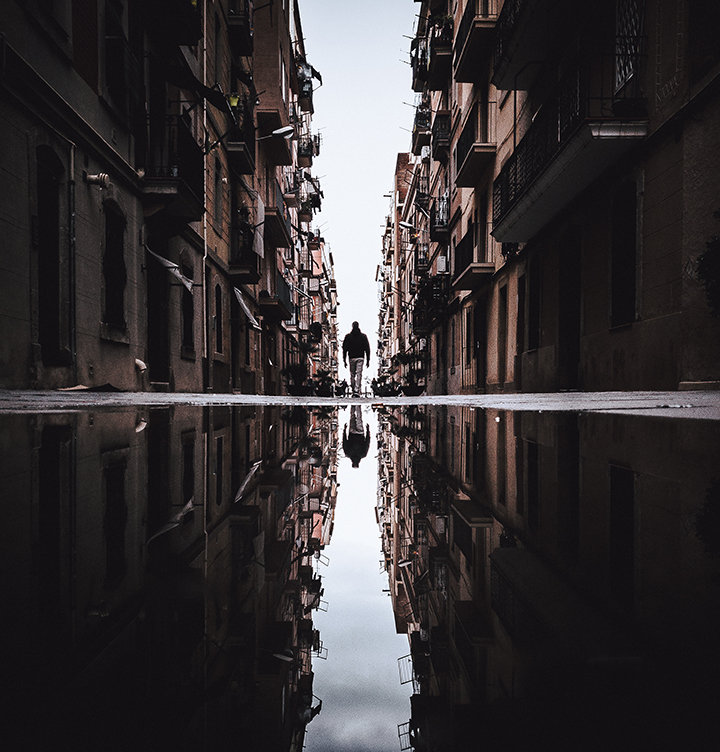The streets of Barcelona reflected in puddles