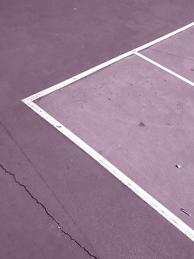 Painted white lines on purple cement.