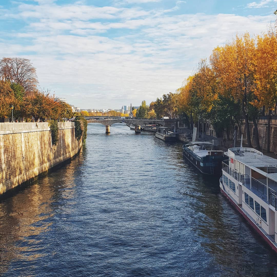River with boats and bridge